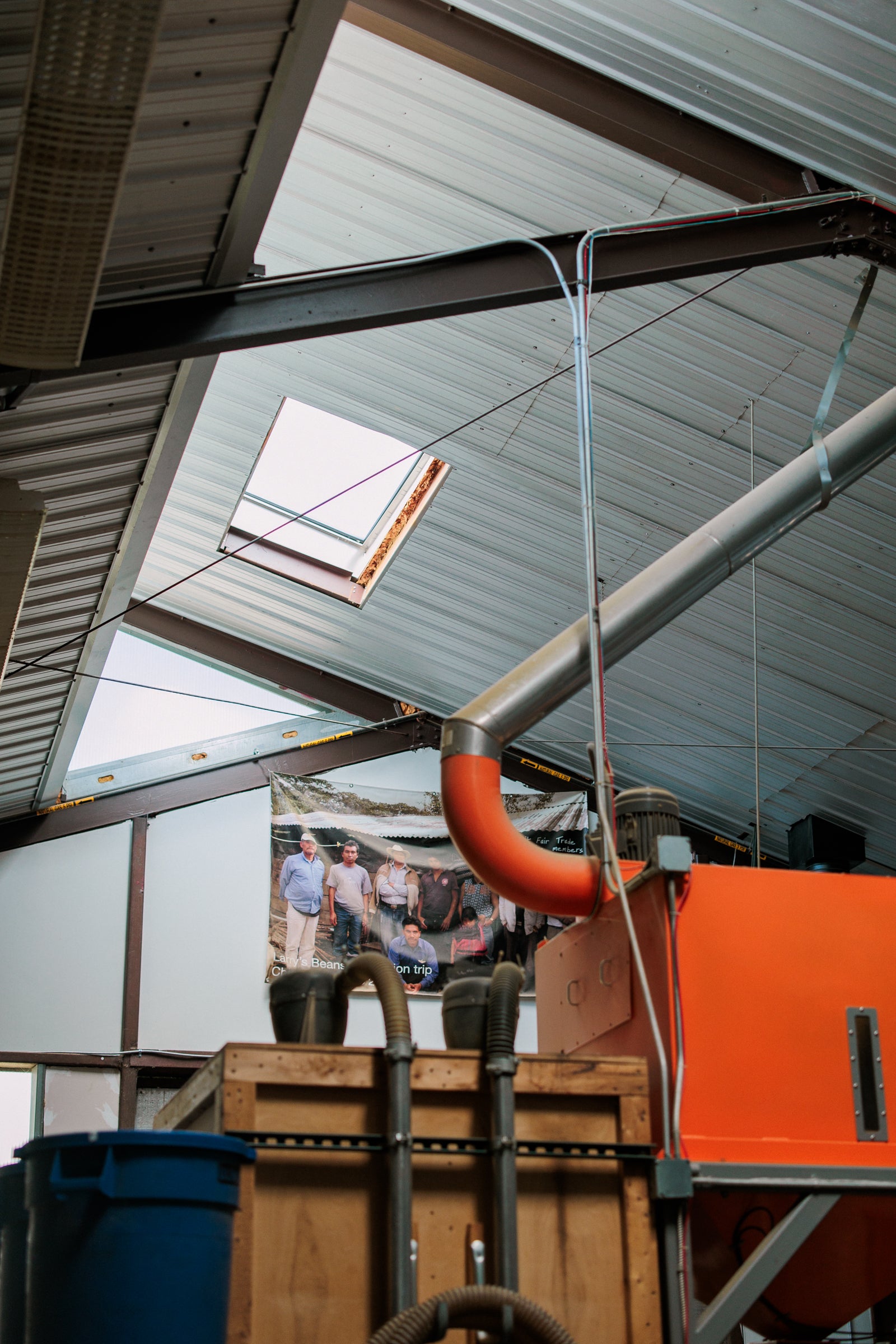 Thoughtful Architecture: The roastery was designed to catch the light. Strategically placed windows and skylights flood the space with daylight so we can reduce the use of overhead lights. In the colder months, the sunlight adds passive warmth to the concrete floor.