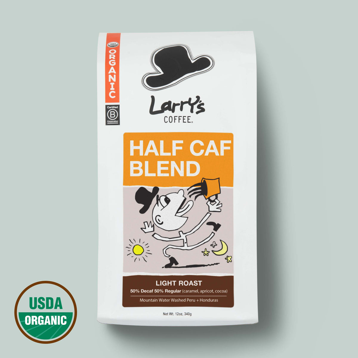 A bag of Larry's Coffee Half Caf Blend light roast organic coffee on a light gray background, featuring a white bag with orange and brown label blocks and a cartoon character.