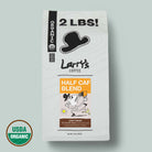 A 2 lb bag of Larry's Coffee Half Caf Blend Light Roast, featuring a white bag with black text and graphics, an orange label, and a USDA Organic seal on a light gray background.